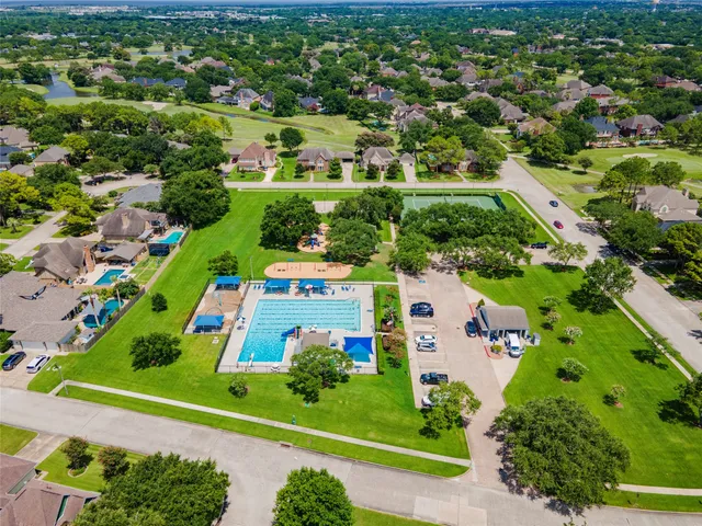 a view of a swimming pool with a lot of trees in it