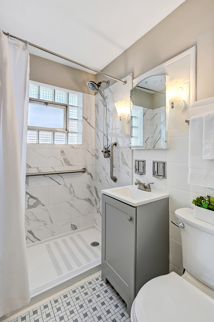 3852 West 80th Street Chicago, IL 60652 - Photo 11 of 19 a bathroom with a sink toilet and shower