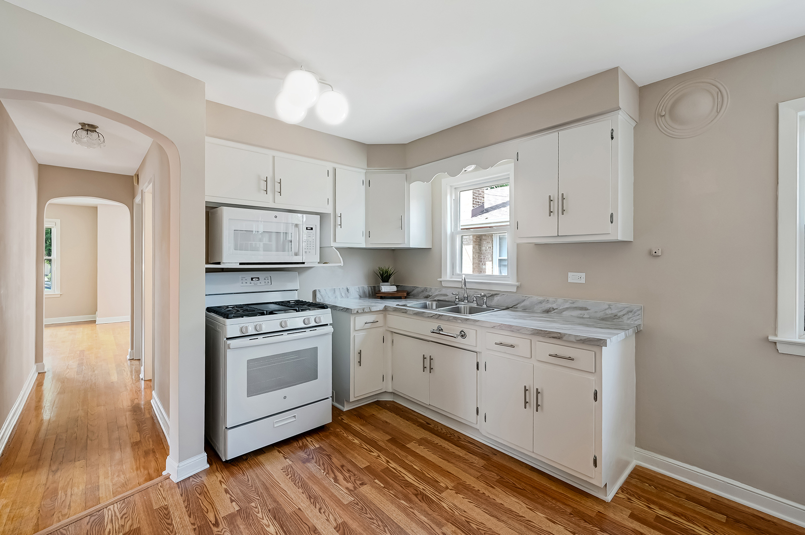 3852 West 80th Street Chicago, IL 60652 - Photo 5 of 19 a kitchen with stainless steel appliances granite countertop a stove a sink and a refrigerator