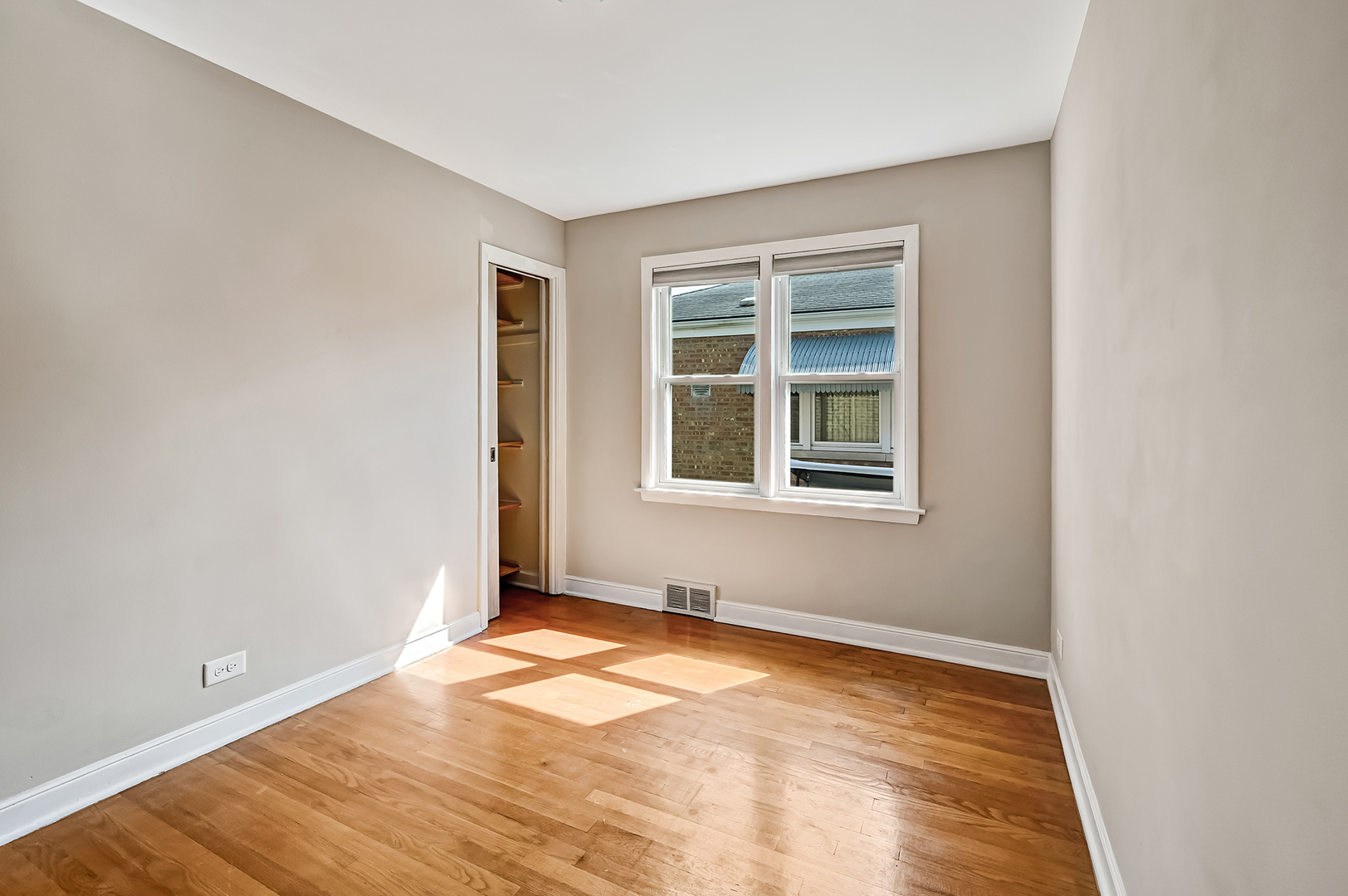 3852 West 80th Street Chicago, IL 60652 - Photo 8 of 19 an empty room with a window