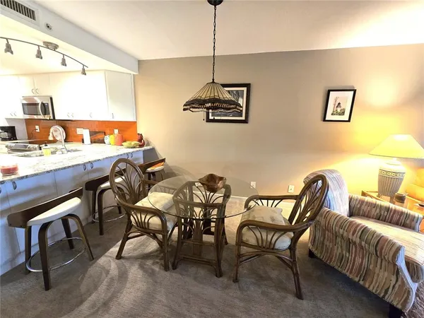 a dining room with furniture and window