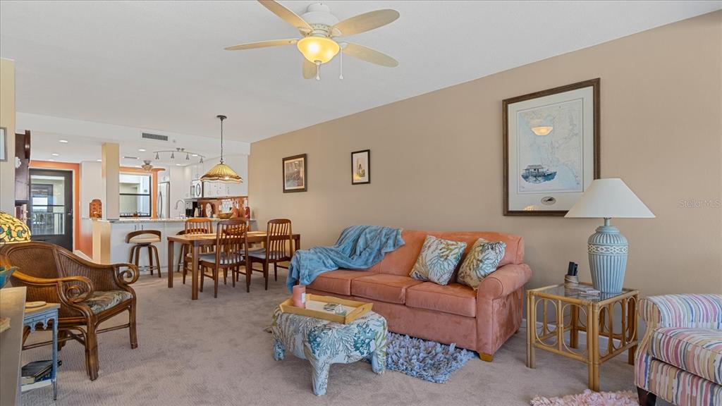 1701 Beach Road, Unit 312 Englewood, FL 34223 - Photo 15 of 39 a living room with furniture and a large window