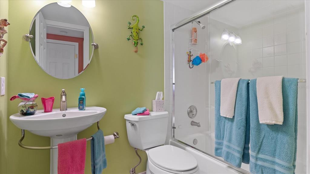 1701 Beach Road, Unit 312 Englewood, FL 34223 - Photo 33 of 39 a bathroom with a sink mirror vanity and toilet