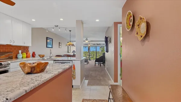 a large kitchen with a table and chairs in it