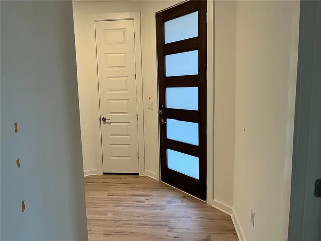 an empty room with a empty space and windows