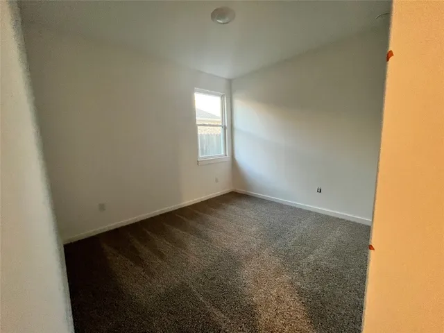 an empty room with a windows