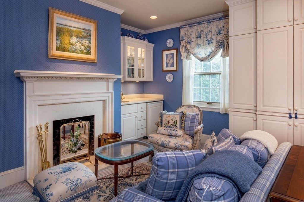 85 Dudley Road Newton, MA 02459 - Photo 12 of 32 a living room with furniture a window and a fireplace