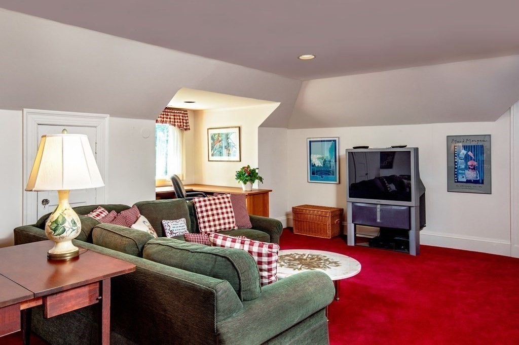 85 Dudley Road Newton, MA 02459 - Photo 18 of 32 a living room with furniture and a flat screen tv