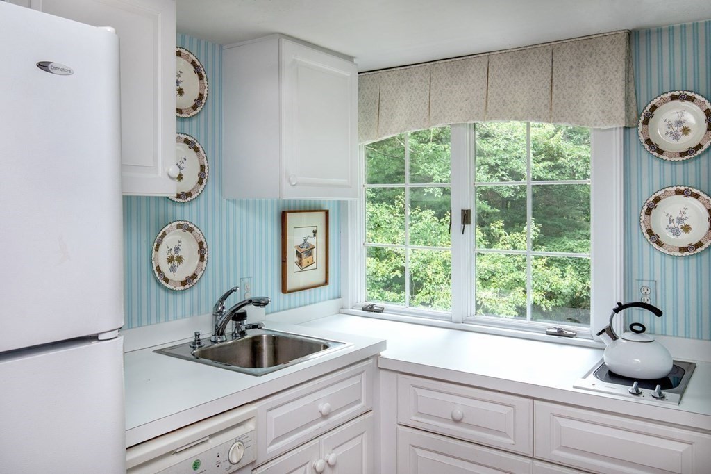 85 Dudley Road Newton, MA 02459 - Photo 19 of 32 a bathroom with a window and a sink