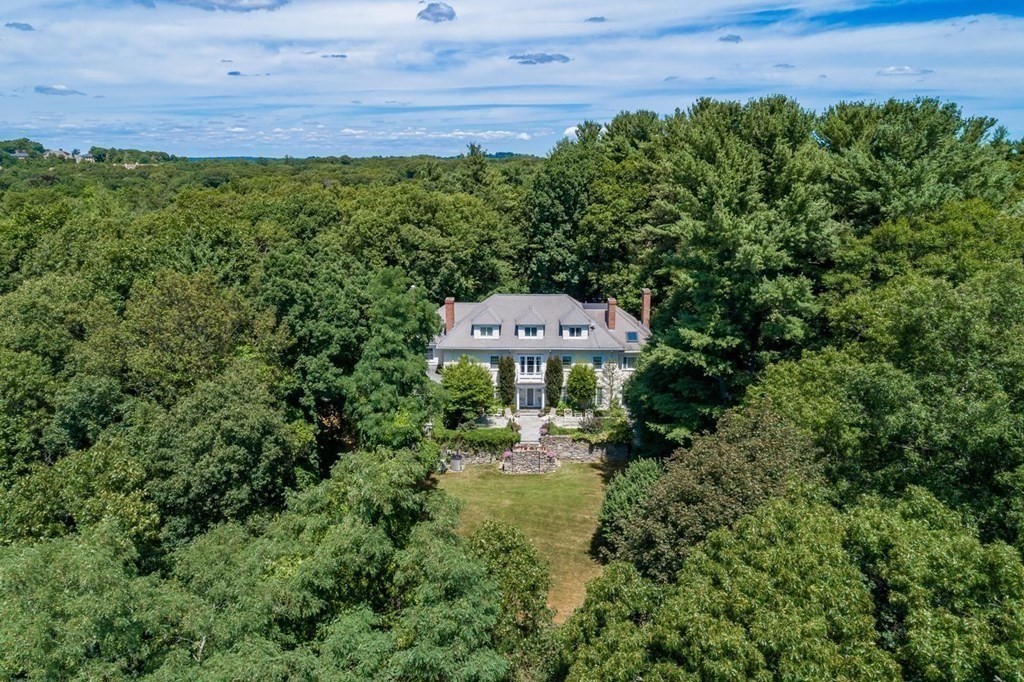 85 Dudley Road Newton, MA 02459 - Photo 2 of 32 a view of a yard with plants and a bench