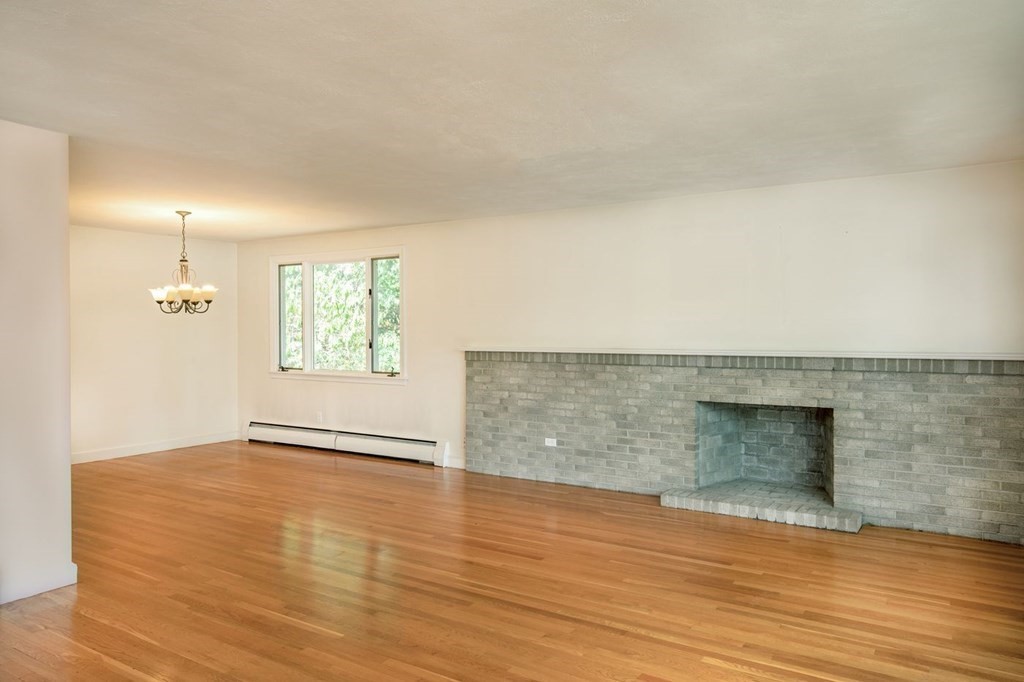 85 Dudley Road Newton, MA 02459 - Photo 28 of 32 an empty room with wooden floor and windows