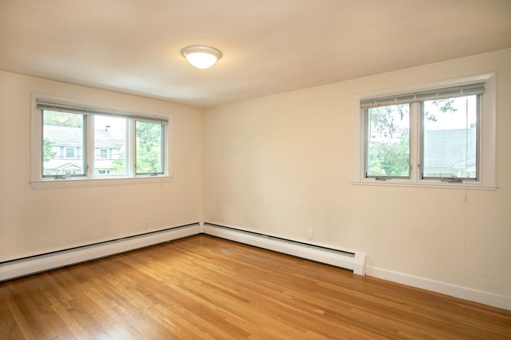 85 Dudley Road Newton, MA 02459 - Photo 30 of 32 a view of an empty room with wooden floor and a window
