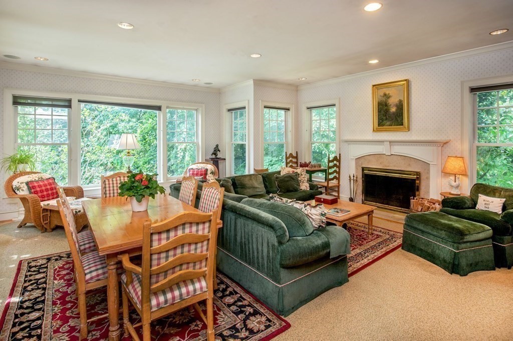 85 Dudley Road Newton, MA 02459 - Photo 6 of 32 a living room with furniture fireplace and large windows