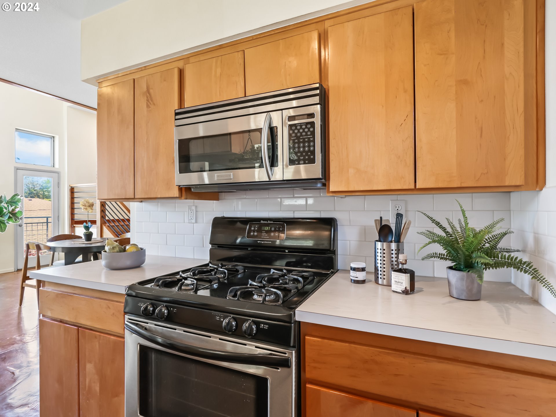 2021 Southeast Clinton Street, Unit 201 Portland, OR 97202 - Photo 13 of 35 a kitchen with a stove and cabinets