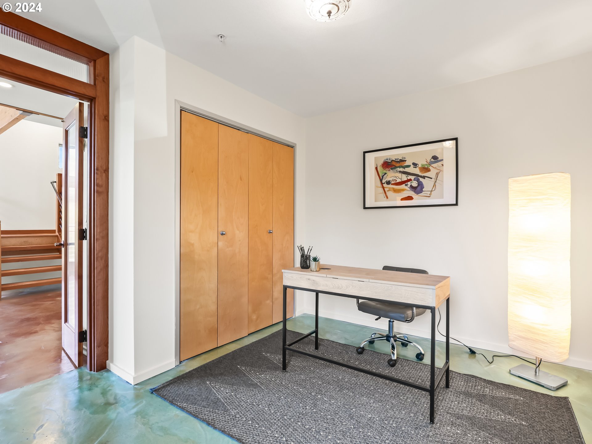 2021 Southeast Clinton Street, Unit 201 Portland, OR 97202 - Photo 15 of 35 a view of a workspace with furniture and a window