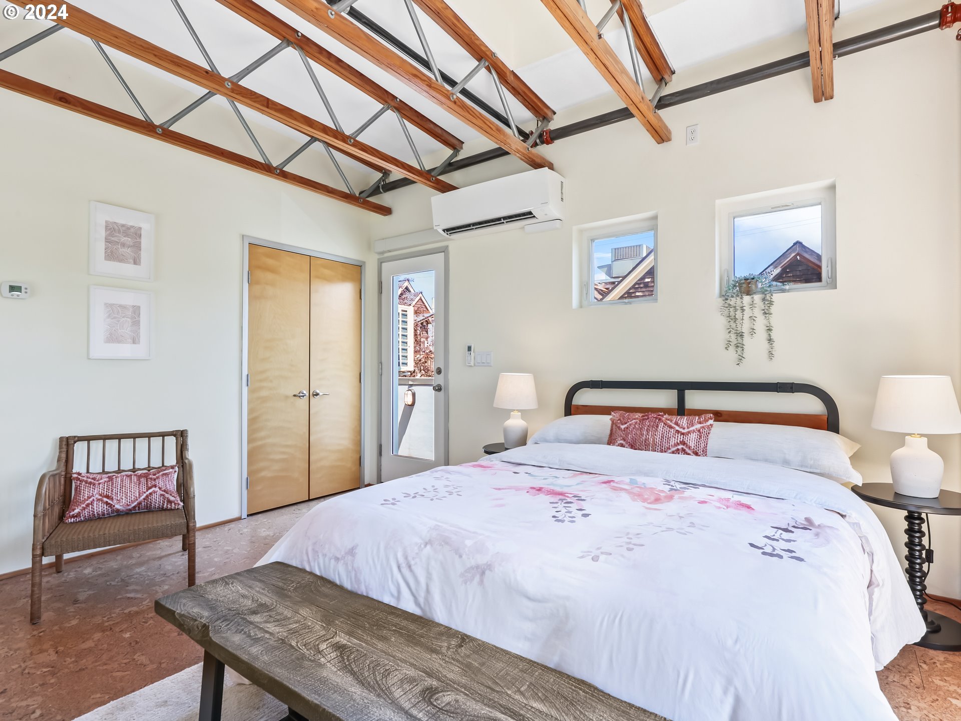 2021 Southeast Clinton Street, Unit 201 Portland, OR 97202 - Photo 21 of 35 a bed room with a bed and a chair