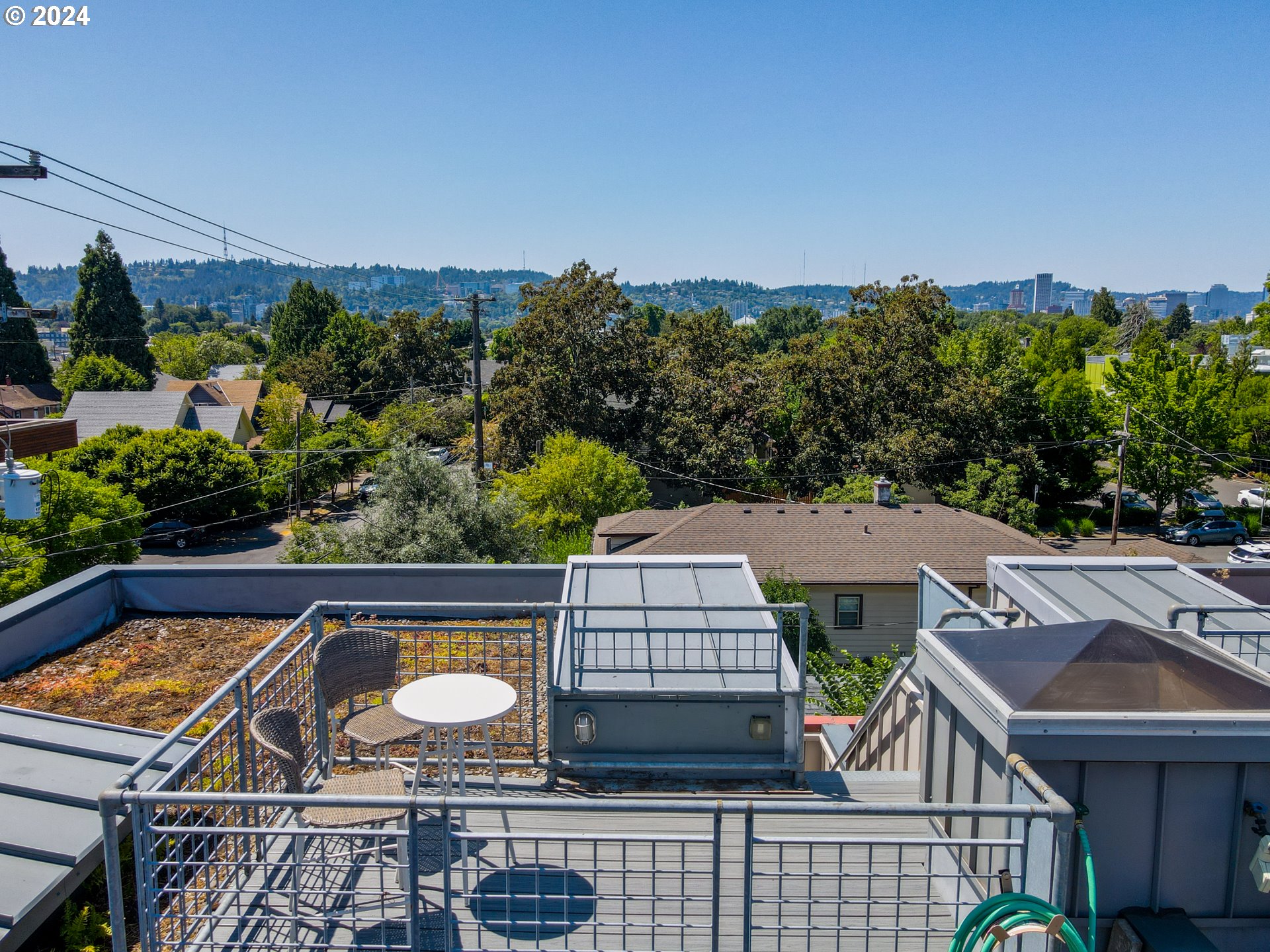 2021 Southeast Clinton Street, Unit 201 Portland, OR 97202 - Photo 33 of 35 an aerial view of a house with swimming pool and glass windows
