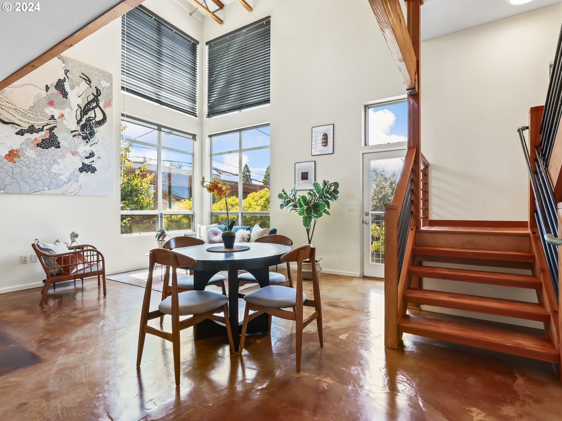 2021 Southeast Clinton Street, Unit 201 Portland, OR 97202 - Photo 4 of 35 a view of a dining room with furniture and wooden floor