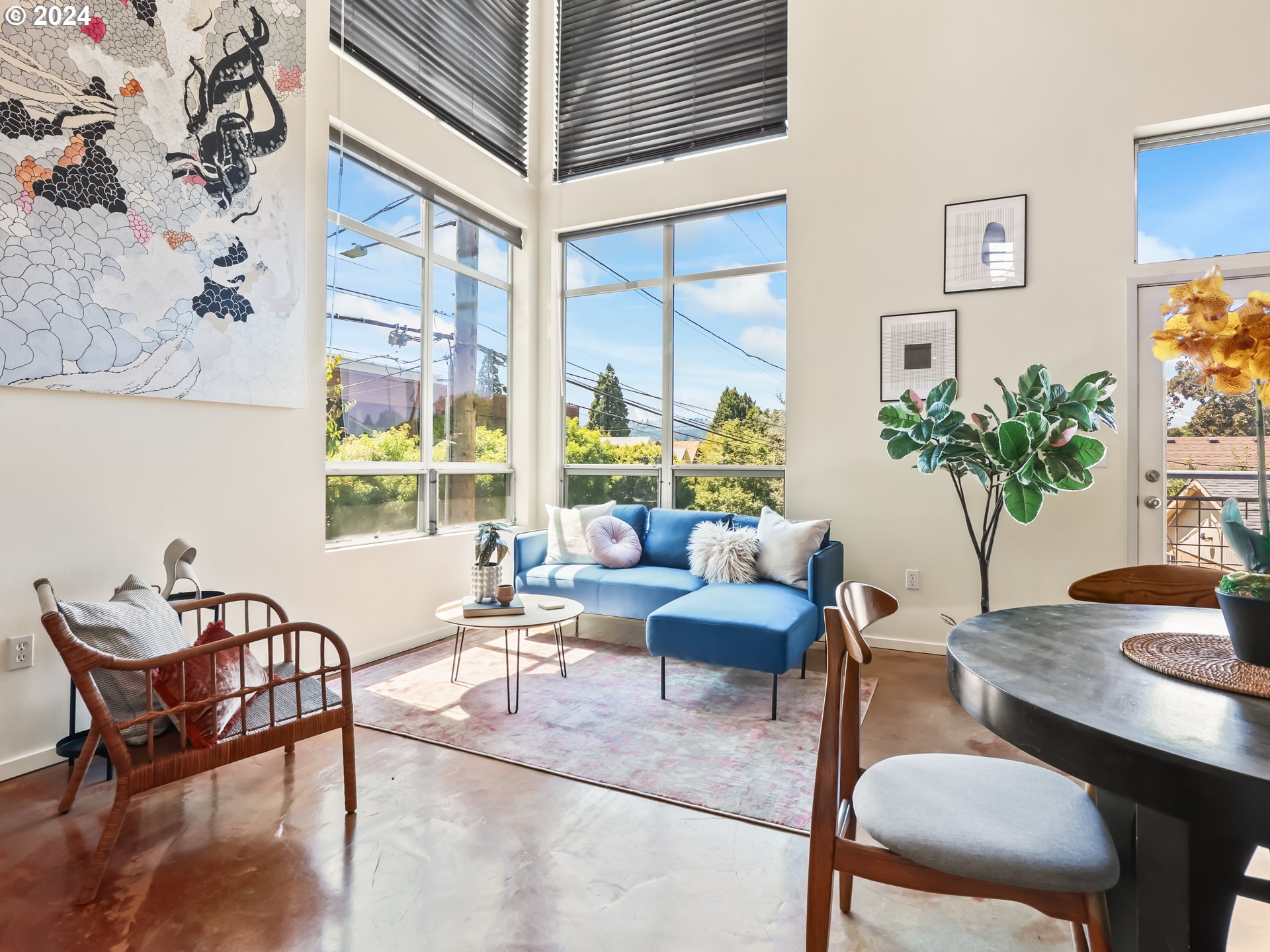 2021 Southeast Clinton Street, Unit 201 Portland, OR 97202 - Photo 5 of 35 a living room with furniture and a potted plant
