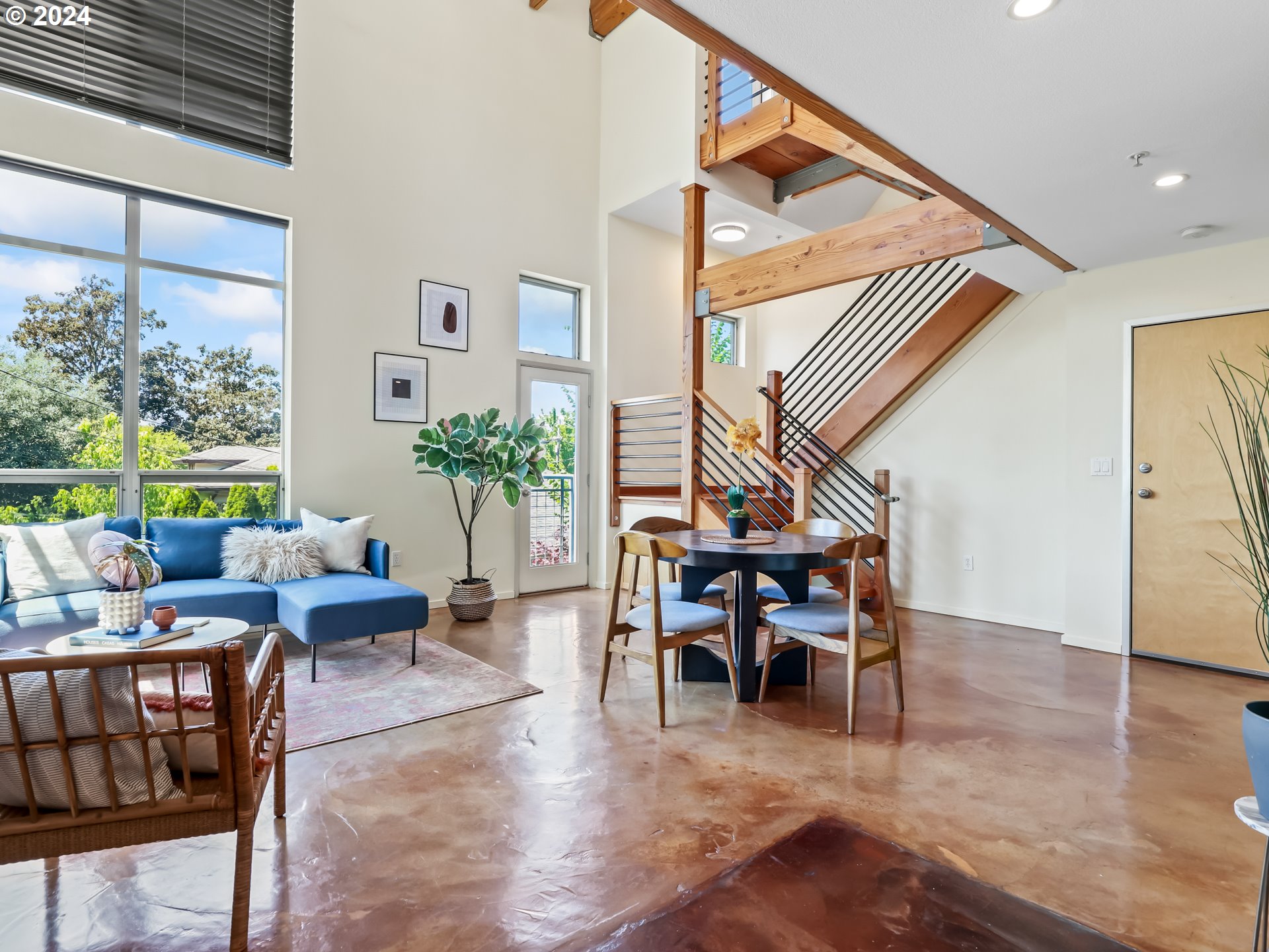 2021 Southeast Clinton Street, Unit 201 Portland, OR 97202 - Photo 6 of 35 a living room with furniture and a large window