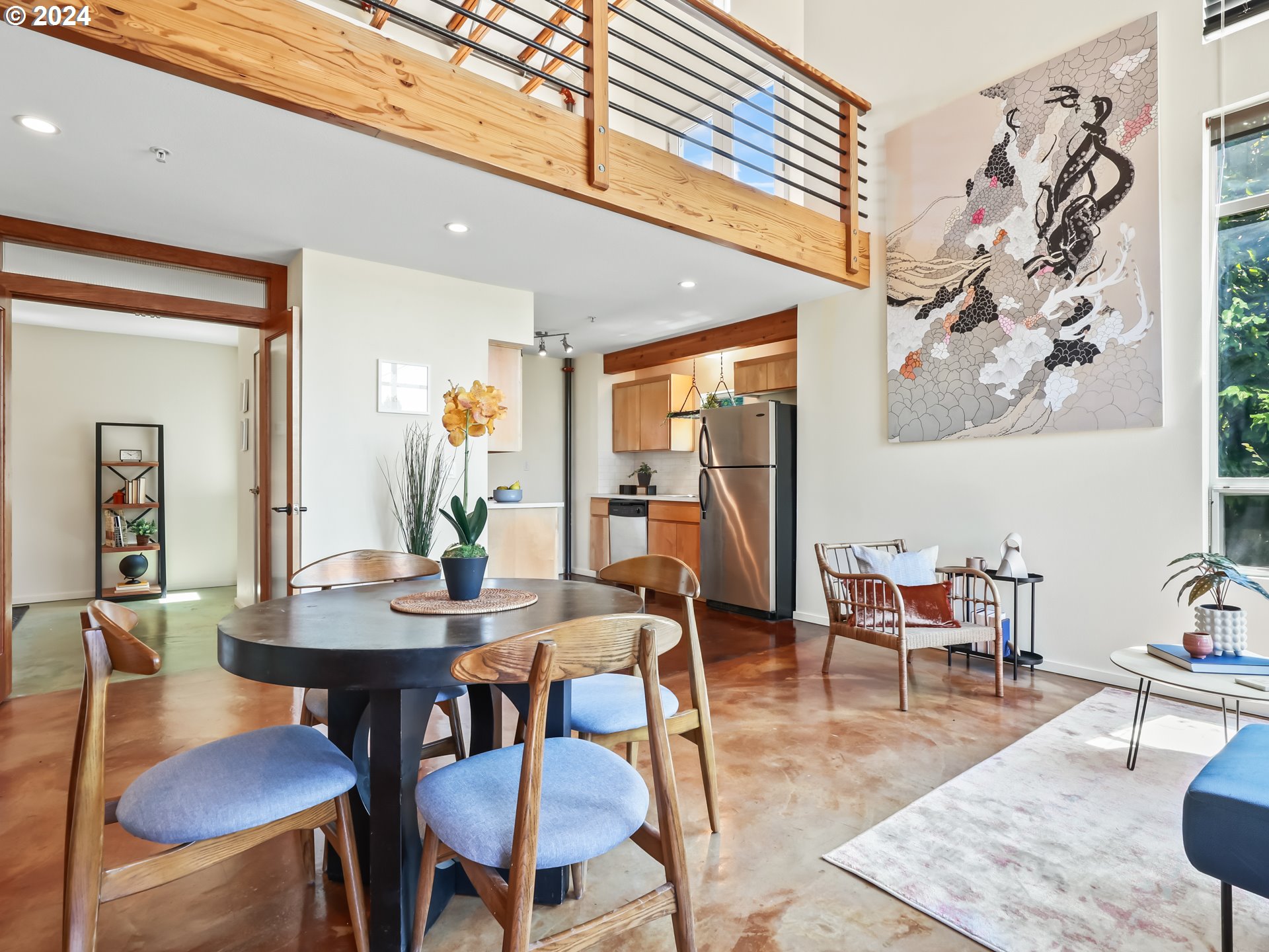 2021 Southeast Clinton Street, Unit 201 Portland, OR 97202 - Photo 7 of 35 a view of a dining room with furniture and wooden floor