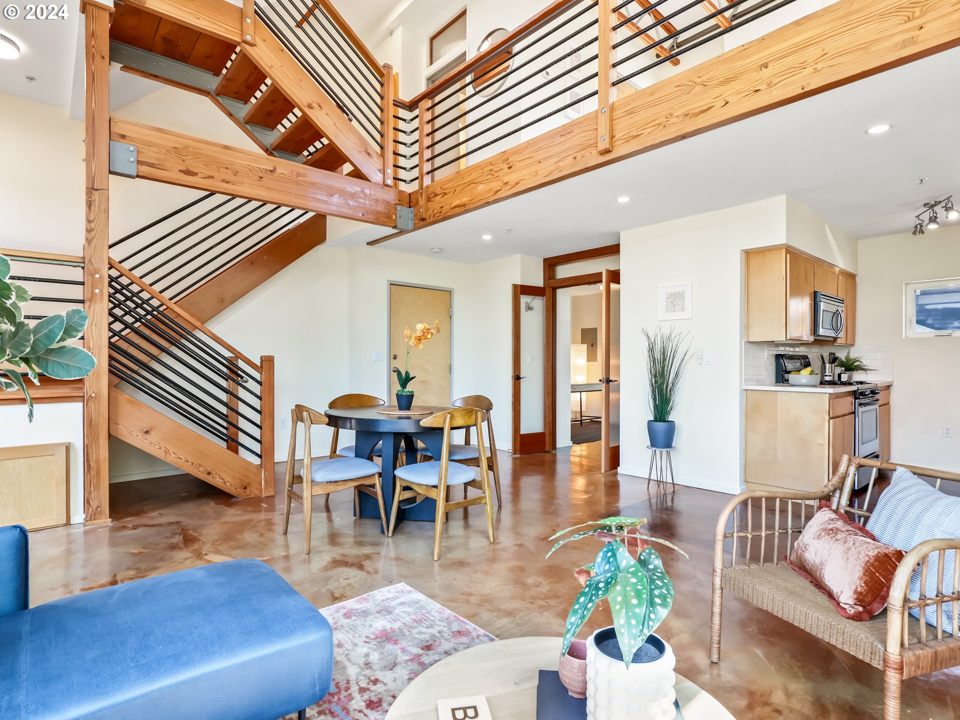 2021 Southeast Clinton Street, Unit 201 Portland, OR 97202 - Photo 9 of 35 a living room with furniture and wooden floor