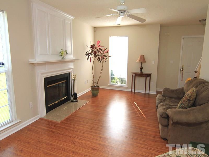 5201 Cardinal Grove Boulevard Raleigh, NC 27616 - Photo 3 of 14 a living room with furniture and a fireplace