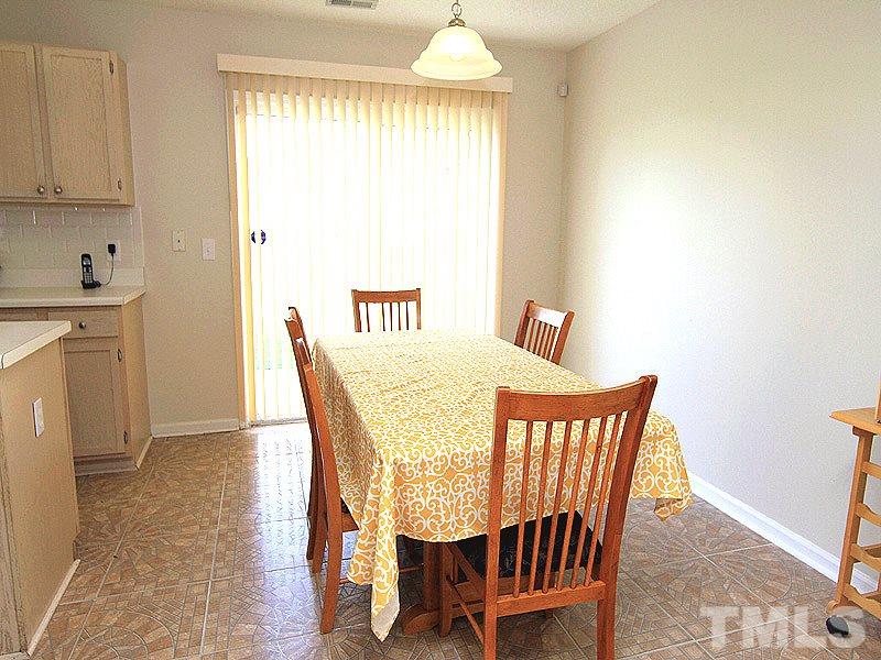 5201 Cardinal Grove Boulevard Raleigh, NC 27616 - Photo 5 of 14 a dining room with furniture and window