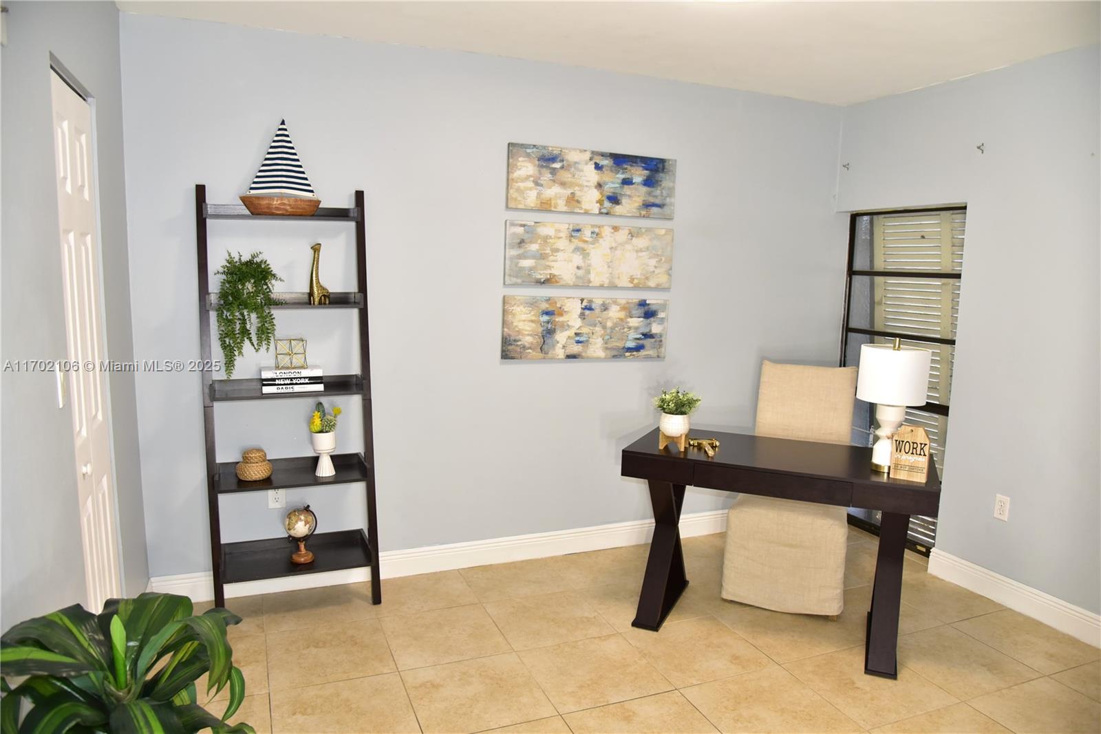 6435 Windmill Gate Road Miami Lakes, FL 33014 - Photo 18 of 29 a workspace with furniture and window