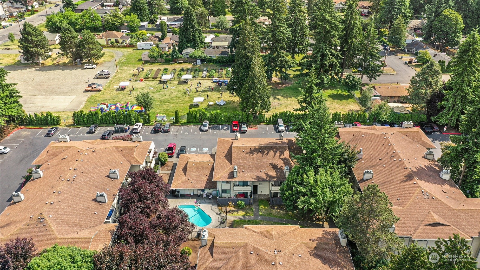 1150 Sunset Boulevard Northeast, Unit 221 Renton, WA 98056 - Photo 3 of 19 an aerial view of a house with a yard and lake view