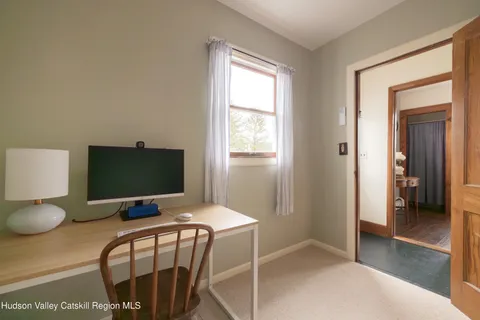 a workspace with furniture and window