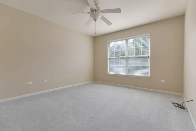 a bathroom with a double vanity sink a mirror and a bathtub