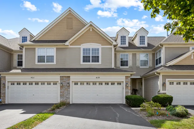a front view of a house with a garage