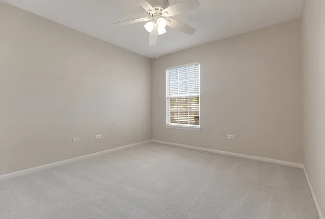 a view of a house with a yard deck and sitting area