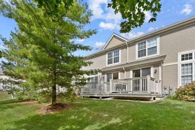 a balcony with wooden floor and fence