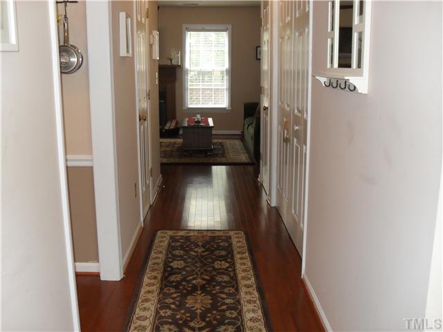 126 Timber Ridge Drive Durham, NC 27713 - Photo 11 of 16 Hall Way Of Foryer That Has New Hardwood Floors. The 1/2 Bath, Coat Closet and Utility Closet Are On The Hall Way