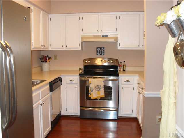Updated Kitchen With New Hardwood Floors and Stainless Steel Appliances. Pass Through To Dinning Area.