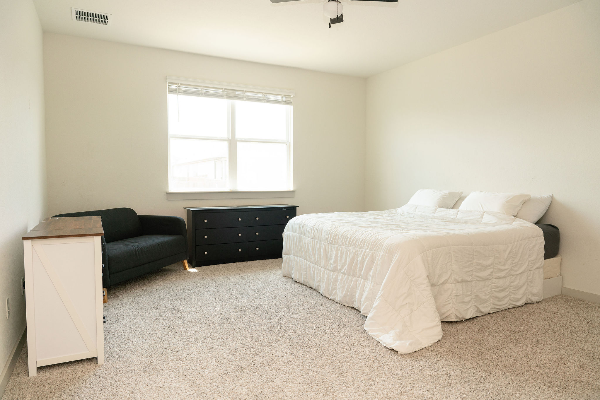 120 Wichita River Road Hutto, TX 78634 - Photo 15 of 31 Plentiful natural light streams across the neutral carpeted floor of this restful sleeping space.