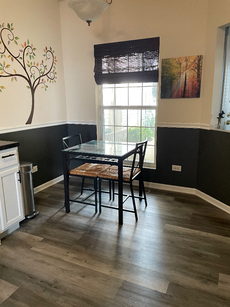 1027 Horizon Ridge Lake In The Hills, IL 60156 - Photo 3 of 21 a workspace with furniture window and wooden floor