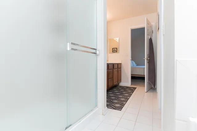 a view of a bathroom from the hallway