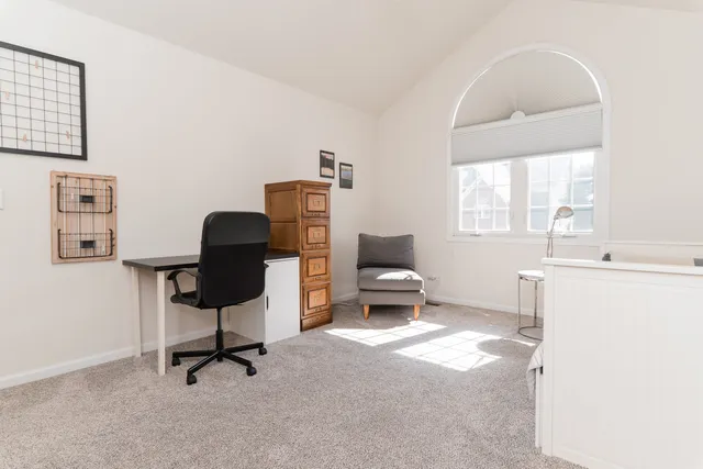 a workspace with furniture and a window