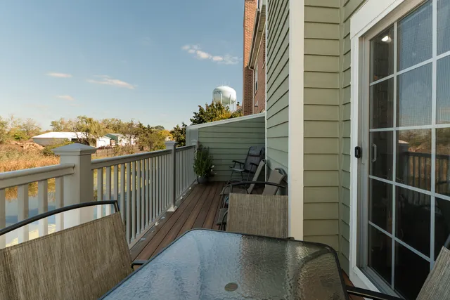 a view of balcony with furniture