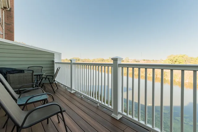 a view of a balcony with chairs
