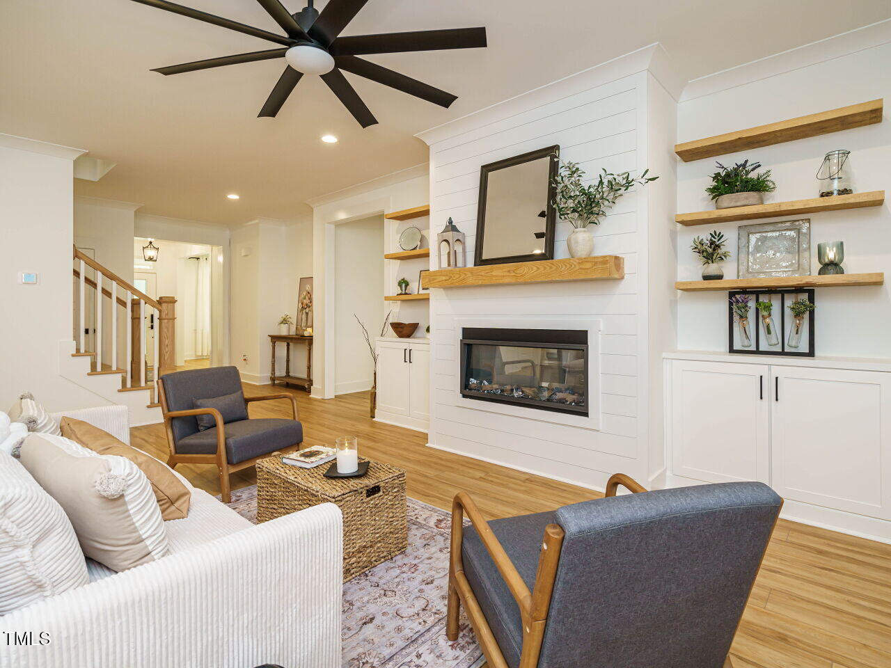 145 Putney Drive Cary, NC 27518 - Photo 11 of 38 a living room with furniture and a fireplace