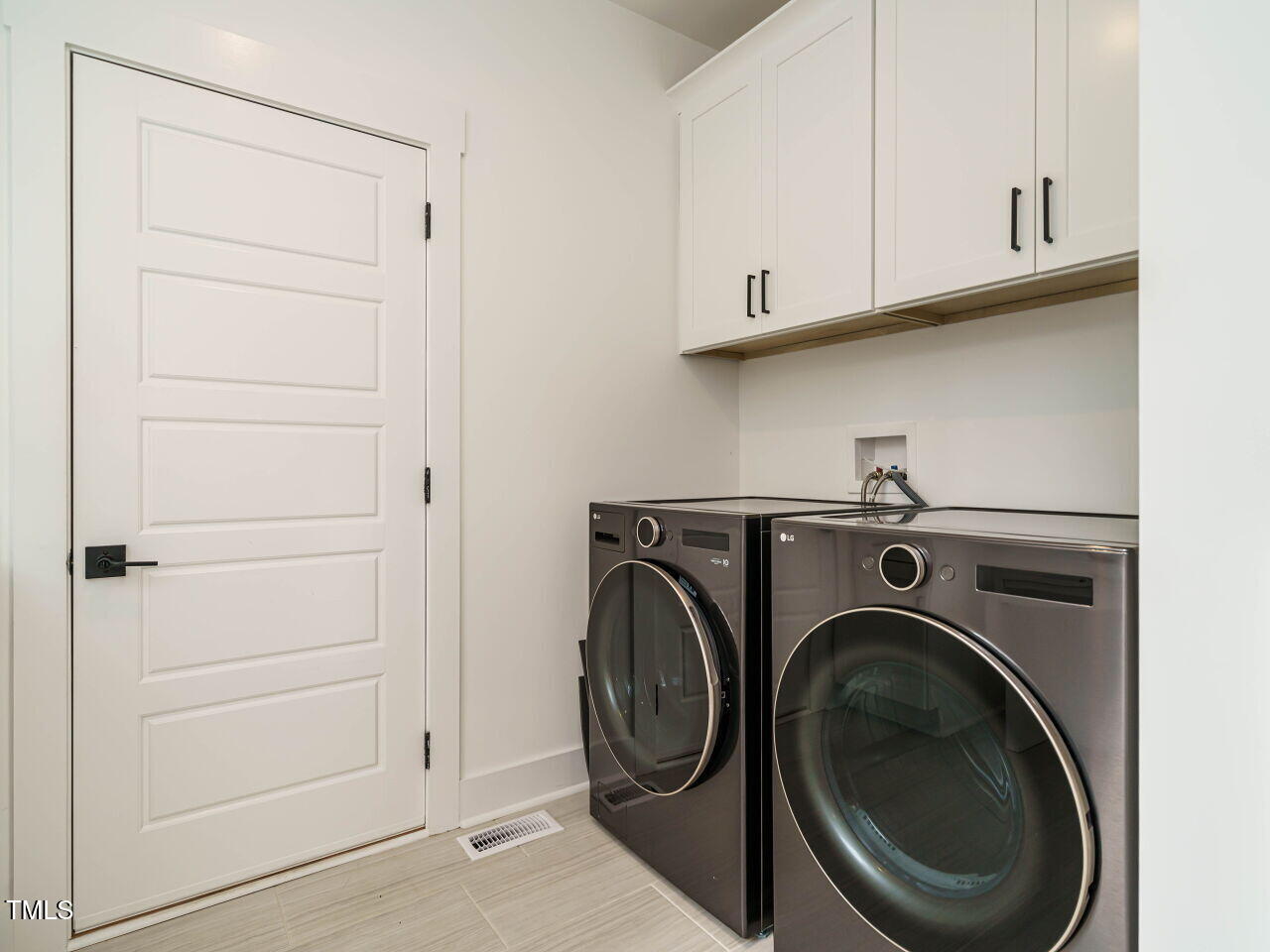 145 Putney Drive Cary, NC 27518 - Photo 21 of 38 a utility room with dryer and washer