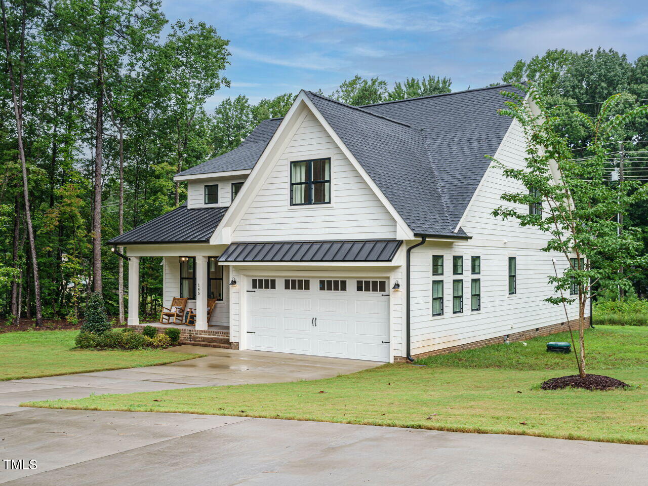 145 Putney Drive Cary, NC 27518 - Photo 3 of 38 a view of a house with a yard