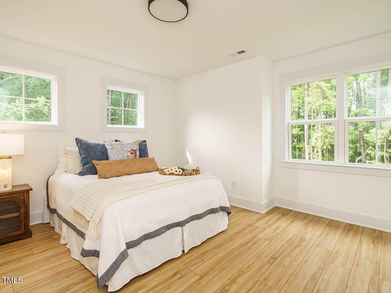 145 Putney Drive Cary, NC 27518 - Photo 34 of 38 a bedroom with a bed and a window