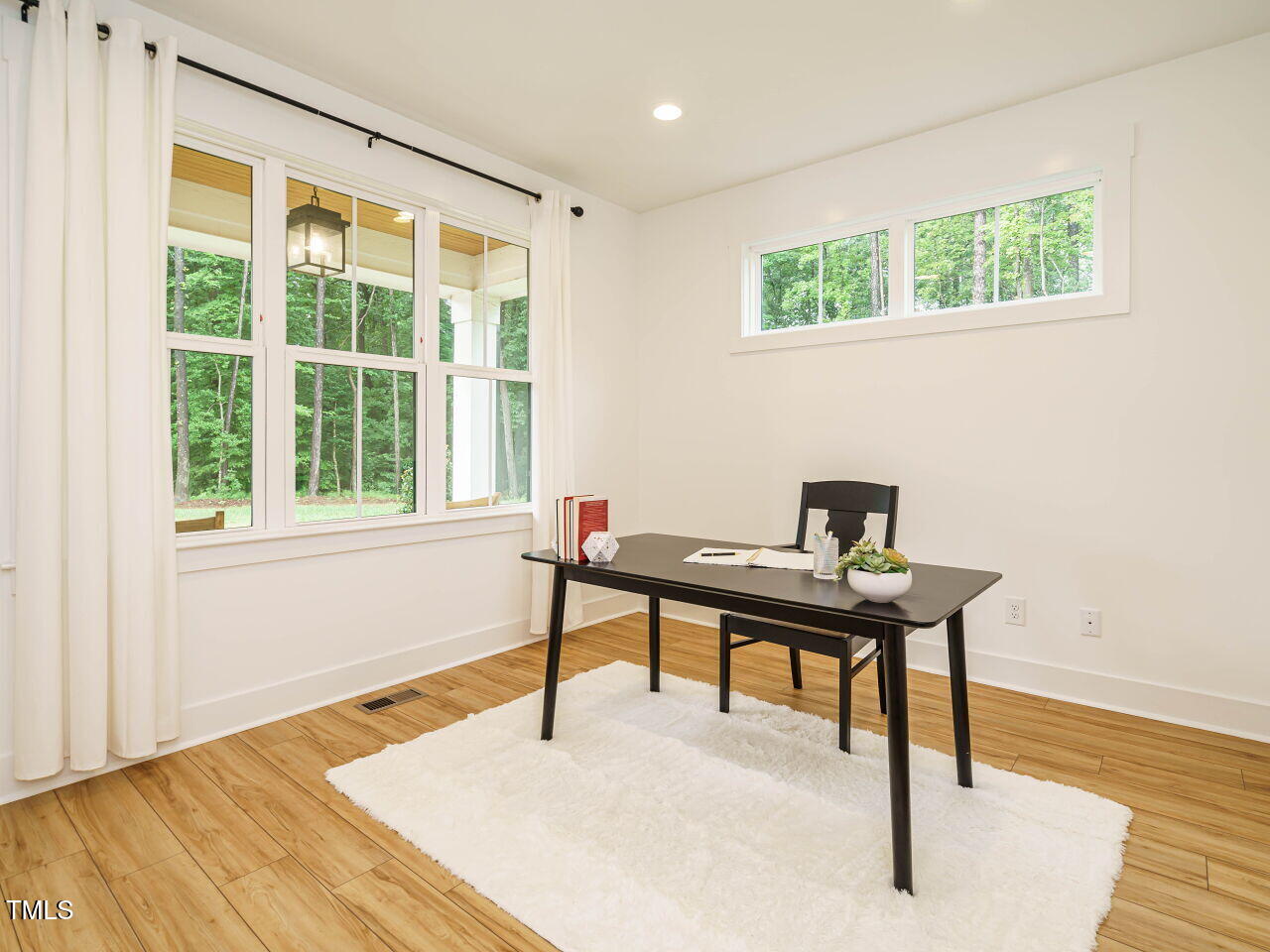 145 Putney Drive Cary, NC 27518 - Photo 7 of 38 a view of a workspace with furniture and a window