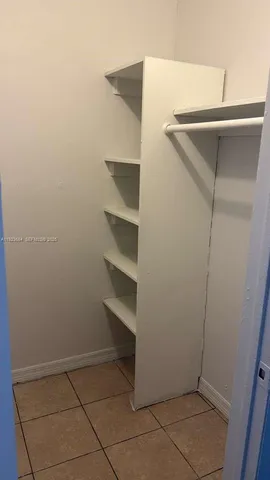 a view of an empty walk in closet