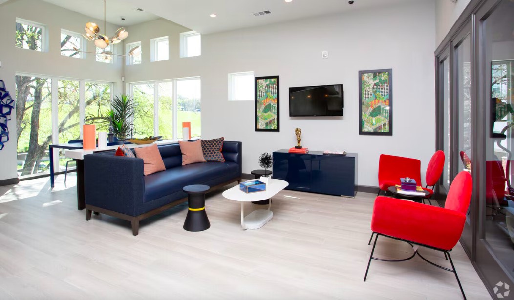 1800 South I- 35 Service Road Austin, TX 78748 - Photo 7 of 21 a living room with furniture and a flat screen tv